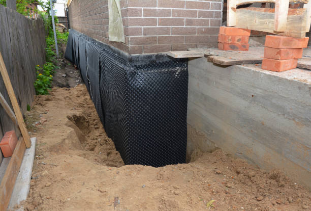 Happy homeowners after waterproofing job in Waunakee